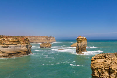 Scenic view of sea against clear blue sky