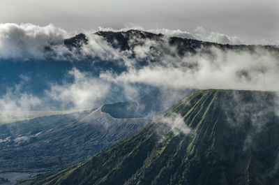 View of mountain range against cloudy sky