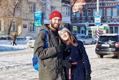 Portrait of a smiling couple in city