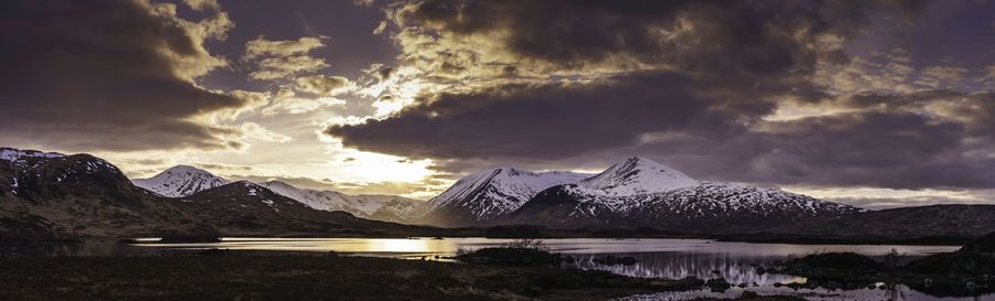 Scenic view of snowcapped mountains against sky during winter