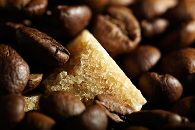 Detail shot of sugar cube on coffee beans