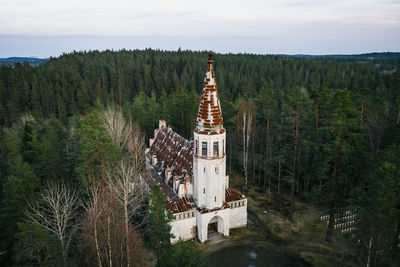 Panoramic view of trees and buildings against sky