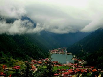 High angle view of trees and mountains against sky