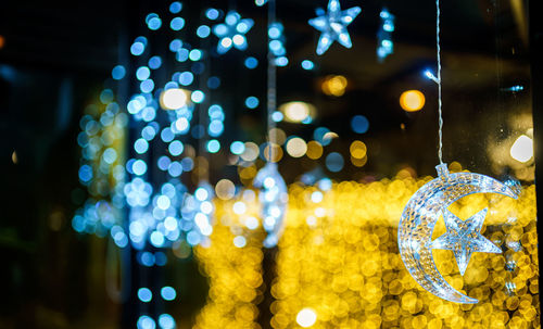 Close-up of illuminated christmas lights at night