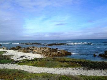 Scenic view of sea against cloudy sky