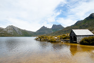 Scenic view of lake and mountains against sky