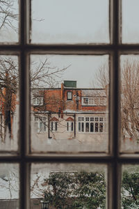 Buildings seen through glass window