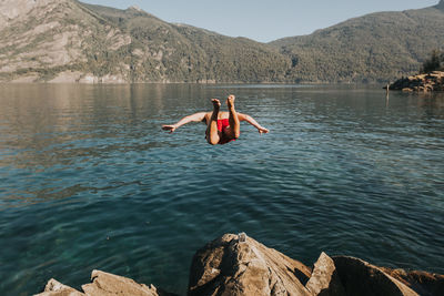 Woman in boat on lake