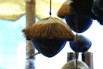 Close-up of rope hanging on roof against sky