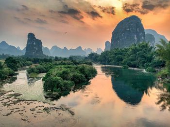 Scenic view of rock formation against sky during sunset