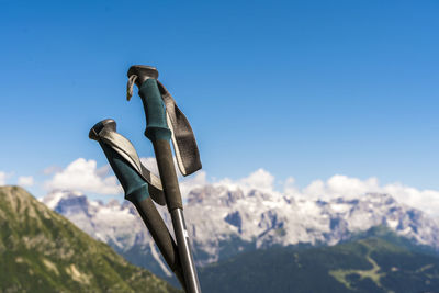 Close-up of hiking poles against clear sky