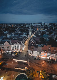 High angle view of illuminated cityscape against sky at night