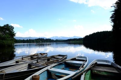 Boats moored in lake