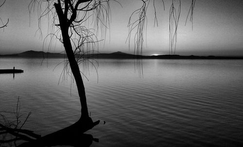 Scenic view of lake against sky during sunset