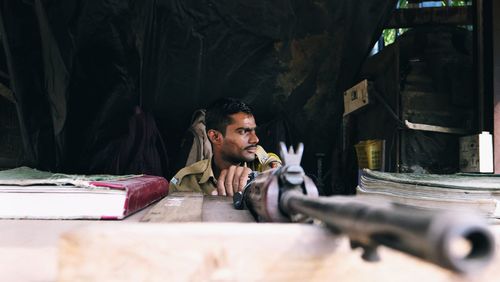 Young man sitting at home