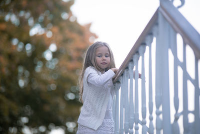 Beautiful little child girl walking in a park