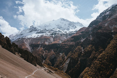 Scenic view of snowcapped mountains against sky