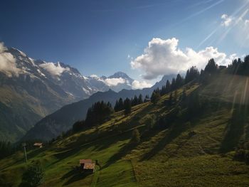 Scenic view of landscape and mountains against sky