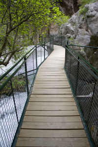 Footbridge with railings in background