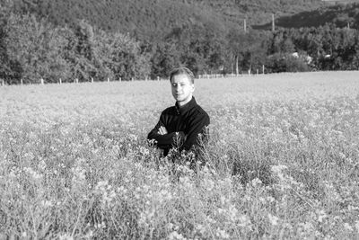 Portrait of young man on field