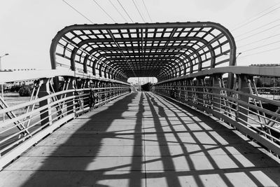 View of footbridge against sky