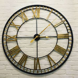 Close-up of clock against wall in building