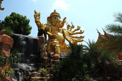 Low angle view of statue against sky