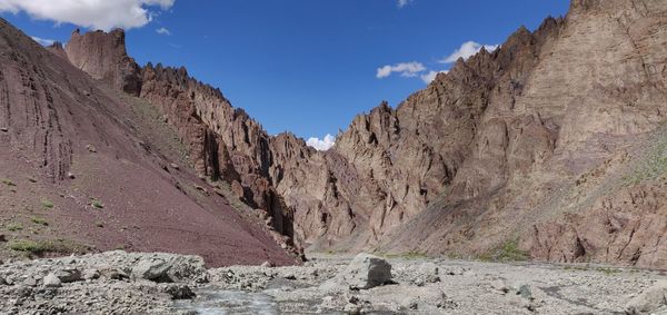 Panoramic view of rocky mountains against sky