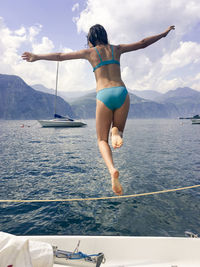 Full length of woman on sea against sky