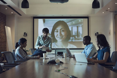 Business people having a video conference in board room