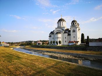 Cathedral by historic building against sky