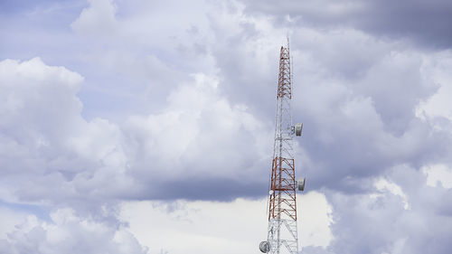 Low angle view of communications tower against sky