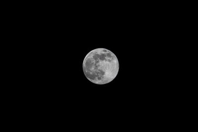 Low angle view of moon against sky at night