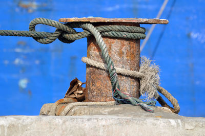 Close-up of rope tied to rusty metal