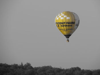 Hot air balloon flying against clear sky