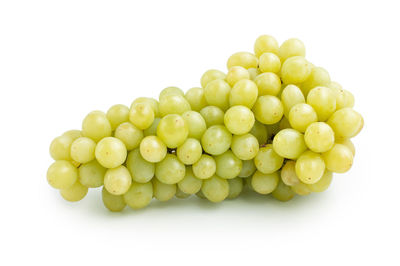 Close-up of grapes over white background