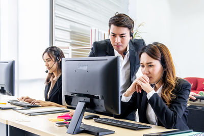 Young couple working on table
