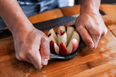 High angle view of man preparing food on cutting board