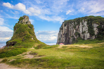 Scenic view of cliff against sky