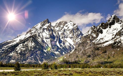 Scenic view of snowcapped mountains against sky