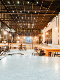 Empty chairs and tables in cafe