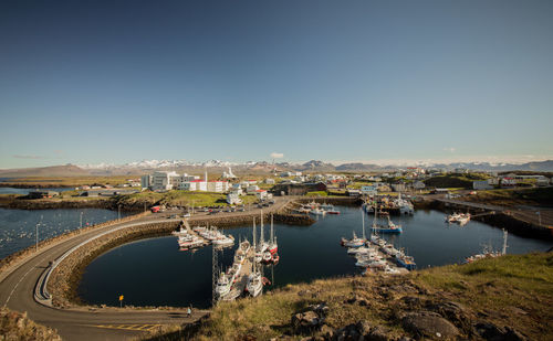 High angle view of bridge over river in city against clear sky