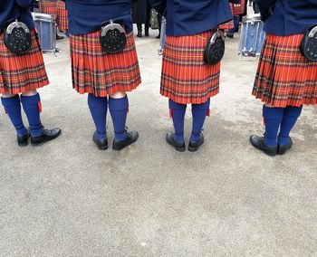 Low section of people standing on floor