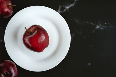 High angle view of fruits in plate on table