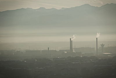 City skyline covered in a dense smog and pollution