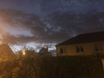 Low angle view of building against sky at dusk