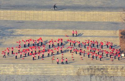 High angle view of women performing on street during event