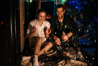 Merry christmas and happy new year. young couple in love celebrating christmas or new year eve at