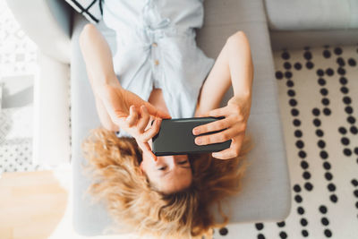 Midsection of woman using mobile phone