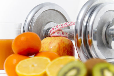 Close-up of oranges in glass container